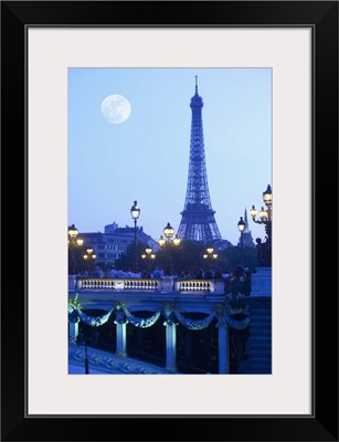 Eiffel tower at dusk with moonrise