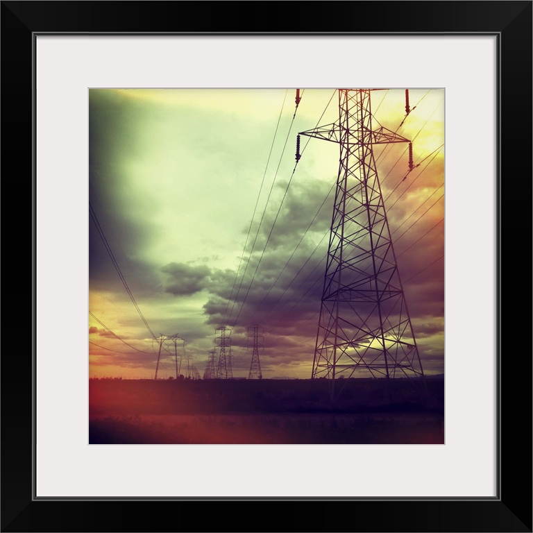 Electricity pylons against cloudy sky in Woodland, California, US.