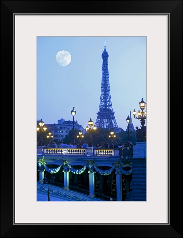 Evening view of Eiffel Tower at moonrise