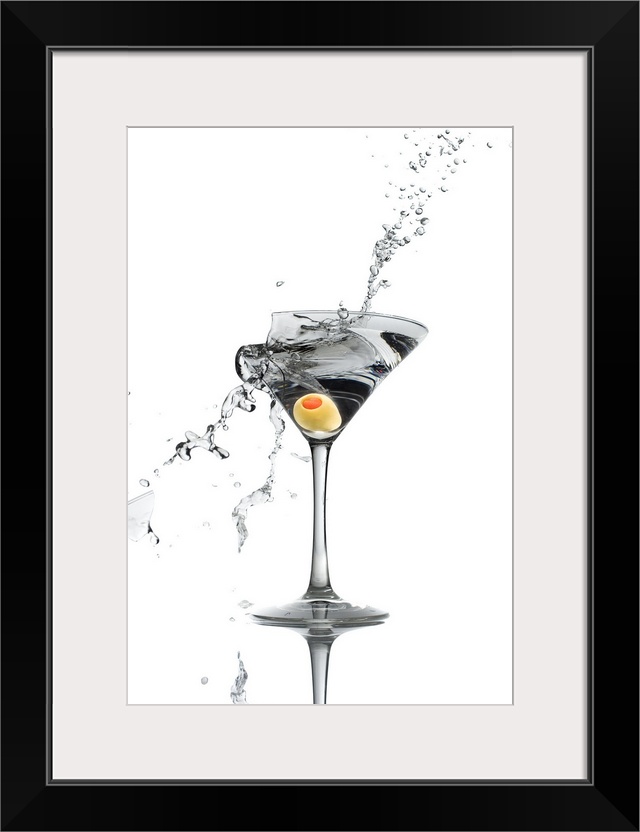 A shattering martini glass on a white background spraying liquid outward.