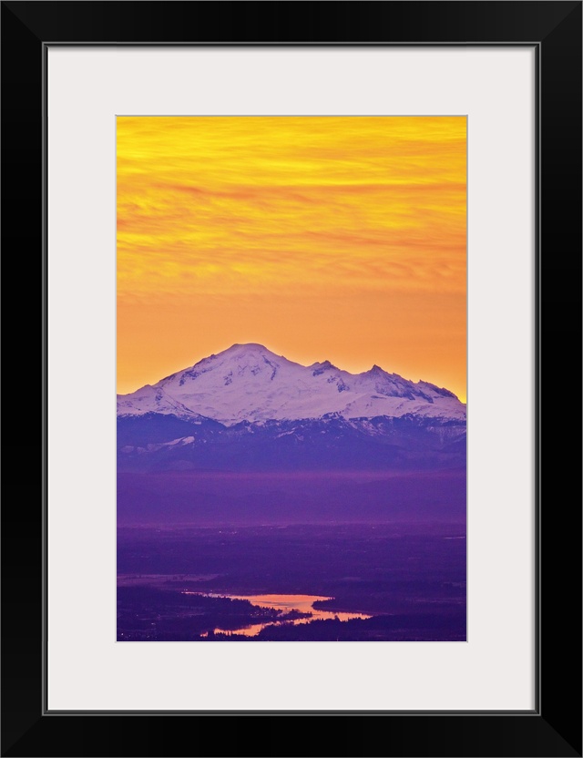 Famous Mt.Baker volcano, located in  North Cascade Mountain Range dominates background while early morning sunlight reflec...