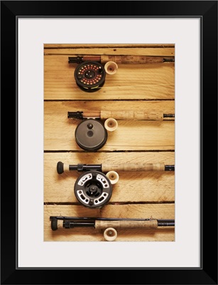 Fly fishing reels hanging on wall