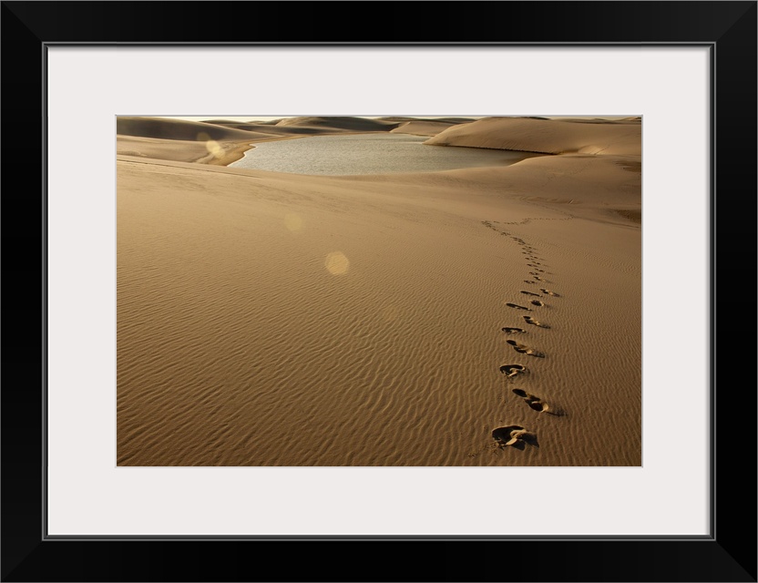 Footprint on sand dune at Lenois Maranhenses in Barreirinhas, Brazil.