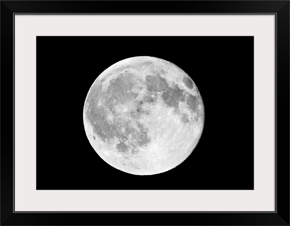 This horizontal wall art shows a photograph of the moon against a dark, starless night sky.