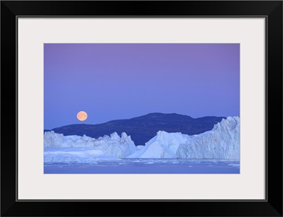 Full moon over iceberg, Ilulissat, Icefjord, Greenland,