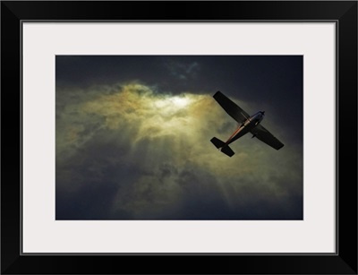 Image of an airplane flying over sunset sky.