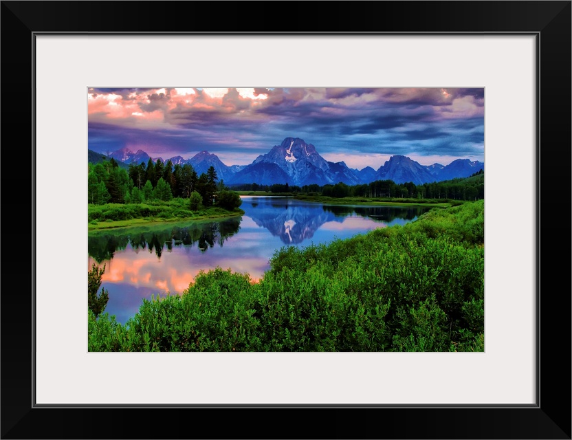 Giant, landscape photograph of morning light breaking through a stormy cloud cover over the Snake River, at Oxbow Bend in ...