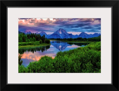 Light breaks through clouds over the Snake River at Oxbow Bend in Grand Tetons