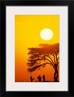 Masai tribe silhouetted at dawn, Kenya