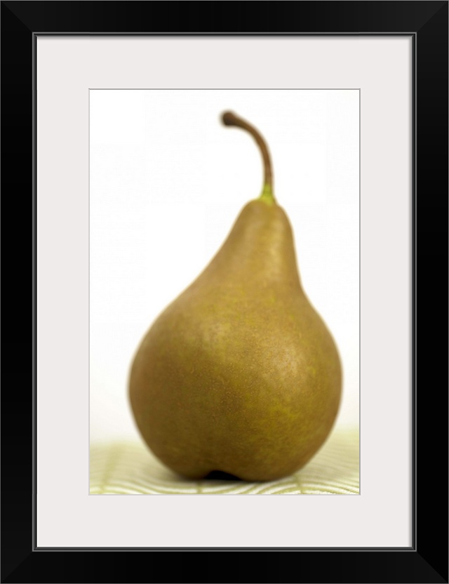 Pear sitting on a mat