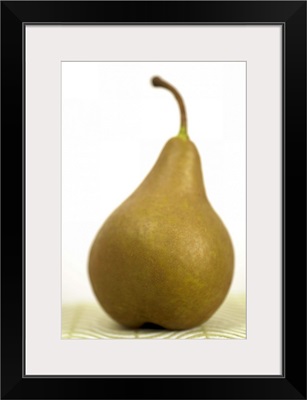 Pear sitting on a mat