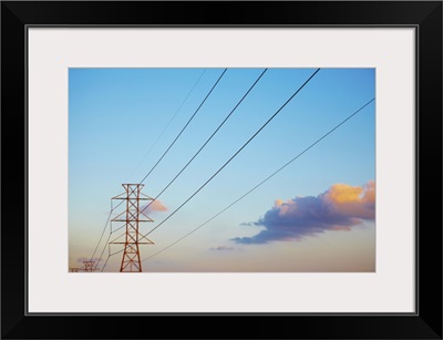 Power lines and blue sky with clouds