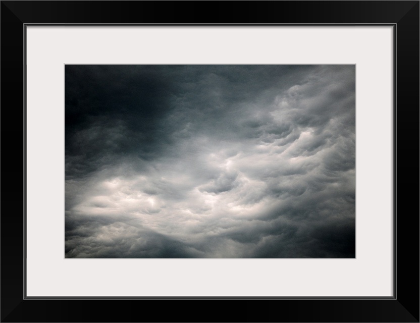 Photograph of dark, ominous rain clouds in the sky.