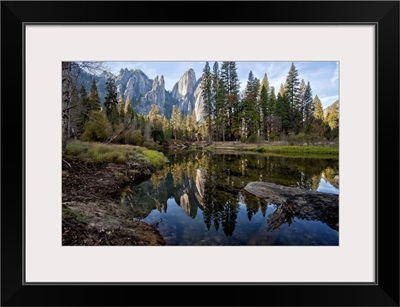Reflections of Cathedral Peaks along Merced River in Yosemite National Park.