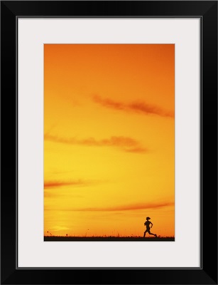 Silhouette of runner at sunset