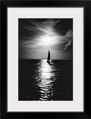 Silhouette of sailboat at sea