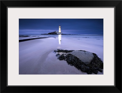 St. Marys Lighthouse, Whitley Bay, glowing at night in blue hour