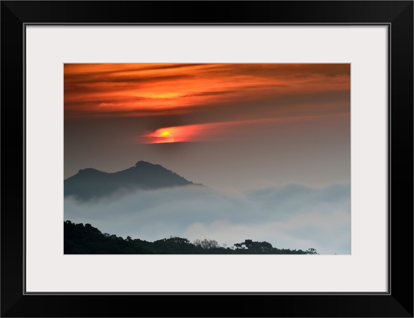 Sunrise against beautiful landscape and fog.