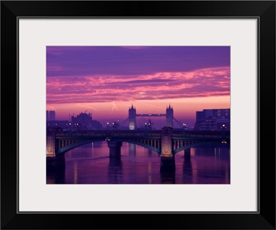 Sunrise over the Thames and Tower Bridge in London.