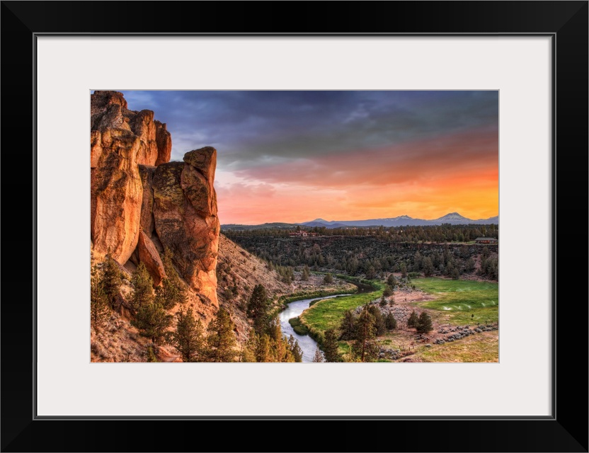 Dramatic sunset creates stunning colors across the Northwestern landscape, where a river runs through a valley separating ...