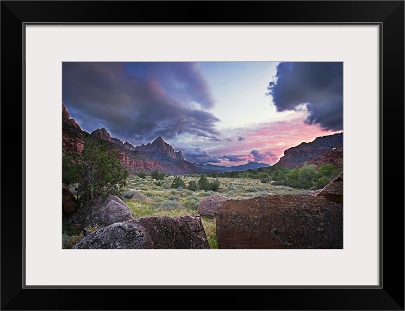 The sun sets with red clouds in Zion National Park