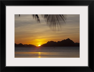 sunset view of tropical islands from the beaches of corong corong