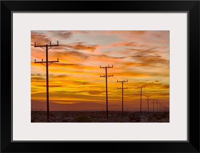 USA, California, Palm Springs, power line at sunrise