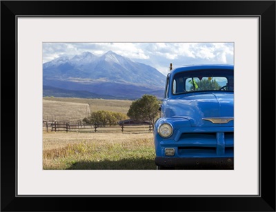 USA, Colorado, Carbondale, Blue vintage car, mount Sopris in background
