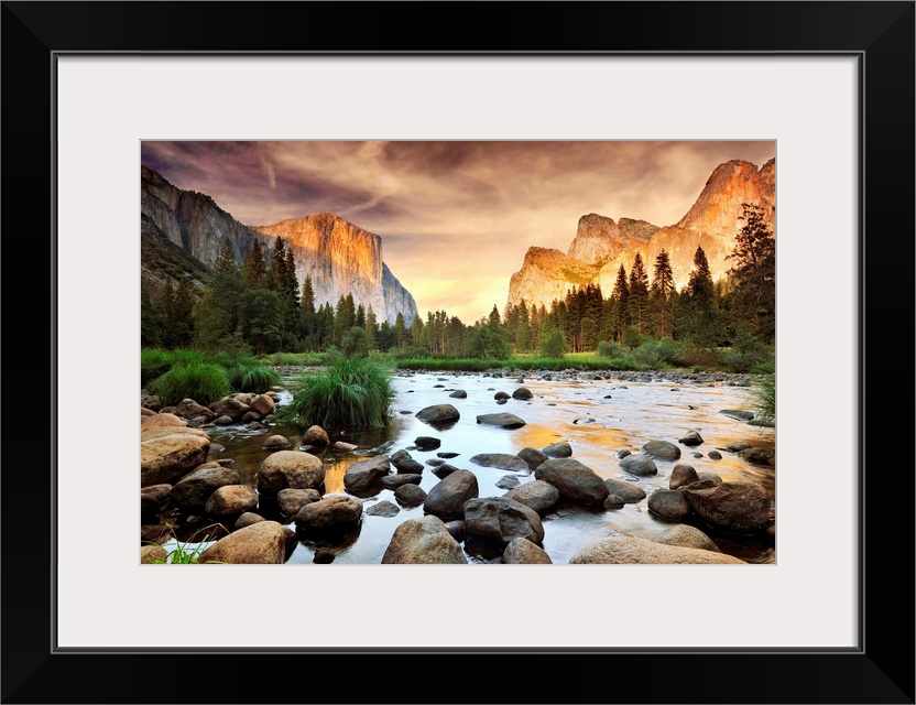 A landscape photograph taken from the valley floor of this national park as the sun illuminates the famous rock faces of t...