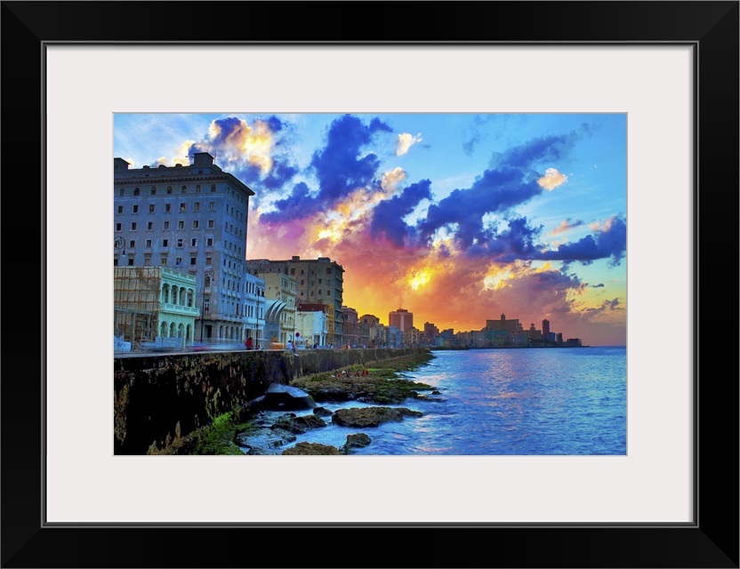 View of buildings and sea during sunset in Cuba.