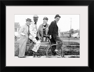 Vintage image of men as clowns on bike