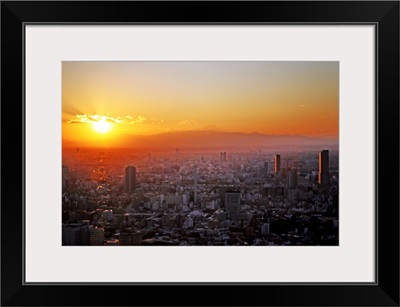 Winter sunset over Tokyo with Mount Fuji in distance, Japan