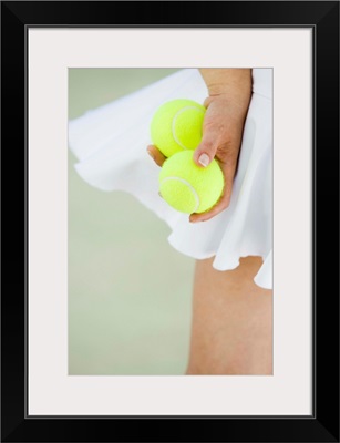 Woman Holding Tennis Balls