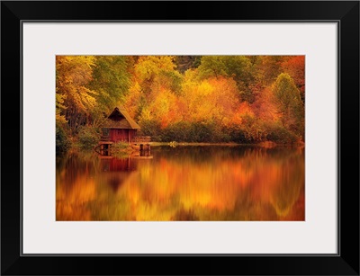 Wooden Cabin On Lake In Autumn