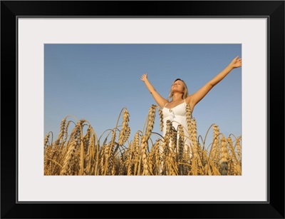 Young woman in corn field