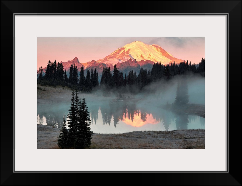 Fine art photo of sunlight hitting the snow peak of Mount Rainier, Washington.