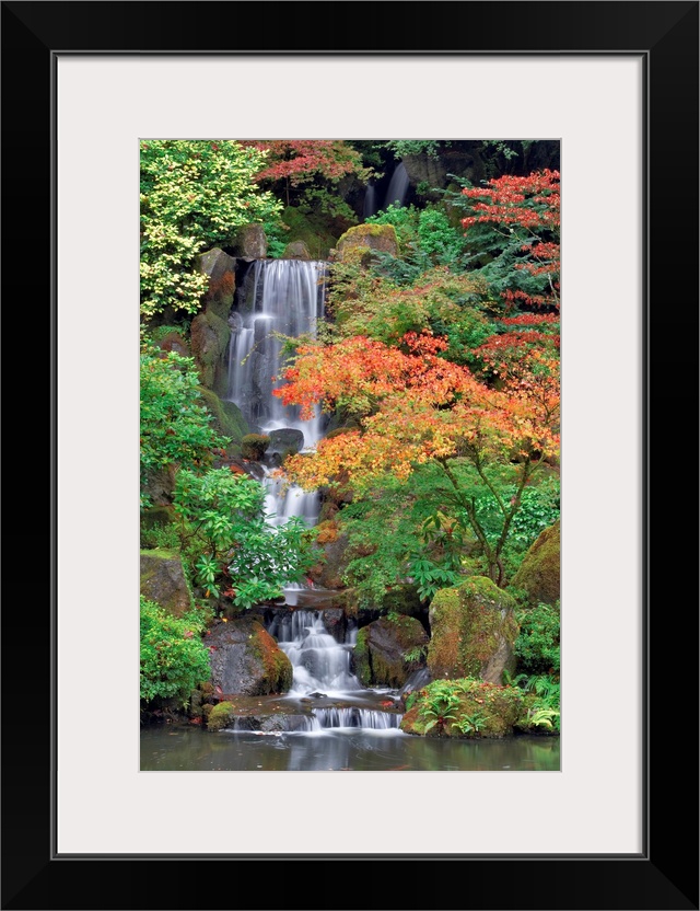 Photograph of waterfall surrounded by autumn trees.