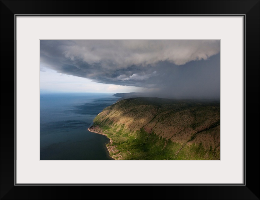 A thunderstorm moves over the eastern shore of Lake Albert.