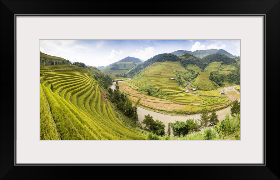 A river flows through lush, green rice terraces, Mu Cang Chai, Yen Bai Province, Vietnam, South-East Asia