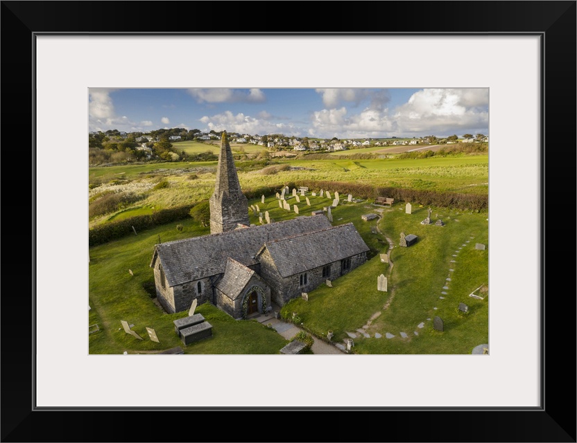 Aerial view of St Enodoc Church in the village of Trebetherick, Cornwall, England. Spring (April) 2022.