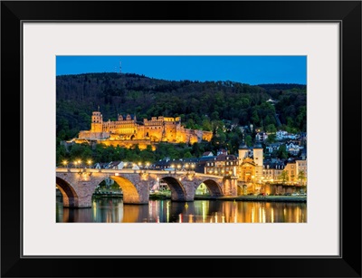 Alte Brucke (old bridge) and Schloss Heidelberg castle on the Neckar River at night
