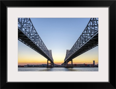 Crescent City Connection, twin span bridges over the Mississippi River at sunset