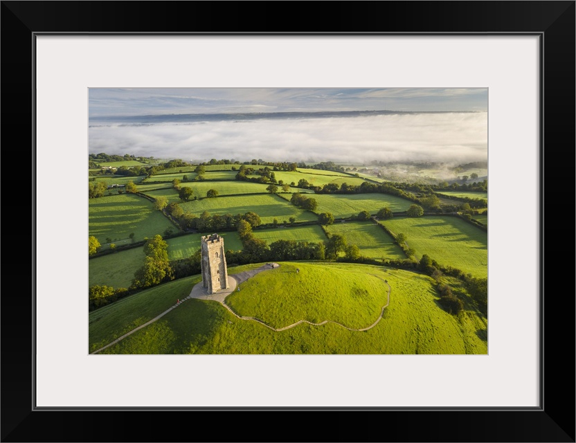 Early morning mists at St Michael's Tower on Glastonbury Tor in Somerset, England. Autumn (September) 2020.