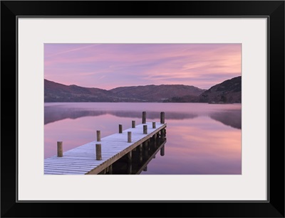 Frosty wooden jetty on Ullswater at dawn, Lake District, Cumbria, England