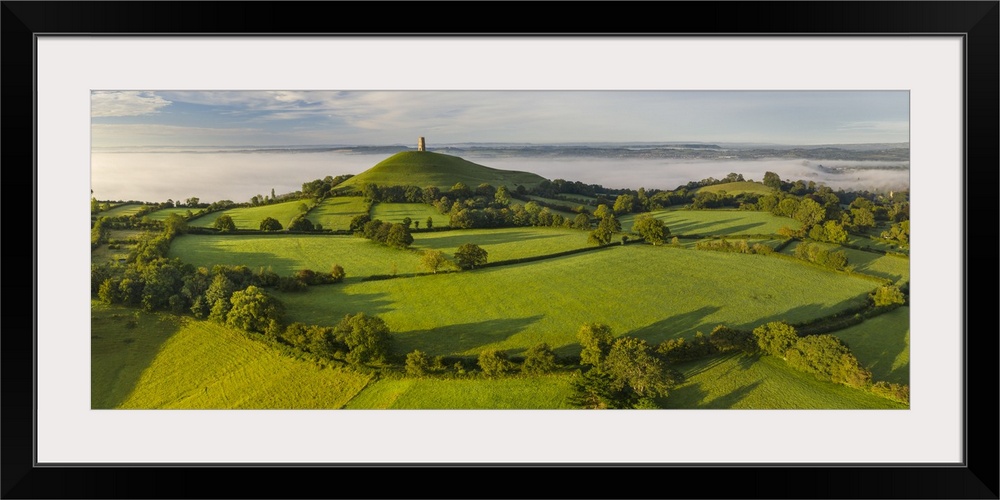 Glastonbury Tor on a sunny September misty morning, Glastonbury, Somerset, England. Autumn (September) 2020.