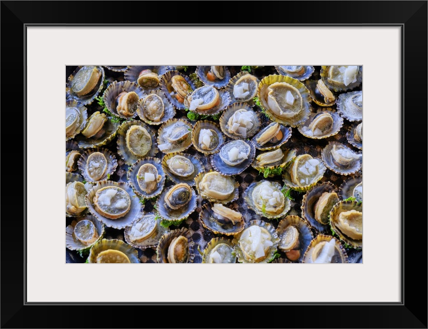 Grilled limpets with garlic, a delicacy. Moledo do Minho, Portugal