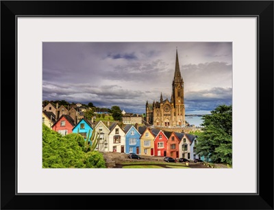 Ireland, Northern Europe; Cobh Cathedral and houses at sunset