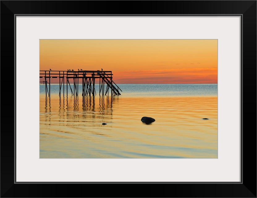 Pier (dock) on Lake Winnipeg at sunrise Matlock, Manitoba, Canada