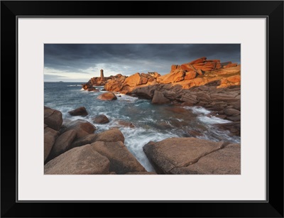 Pink Granite coast, Brittany, France. The Ploumanach lighthouse an sunset