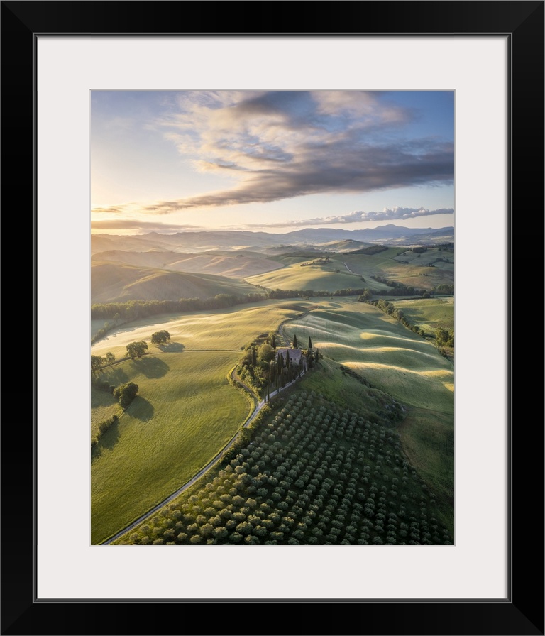 Podere Belvedere and the surrounding countryside at sunrise. San Quirico d'Orcia, Val d'Orcia, Tuscany, Italy.